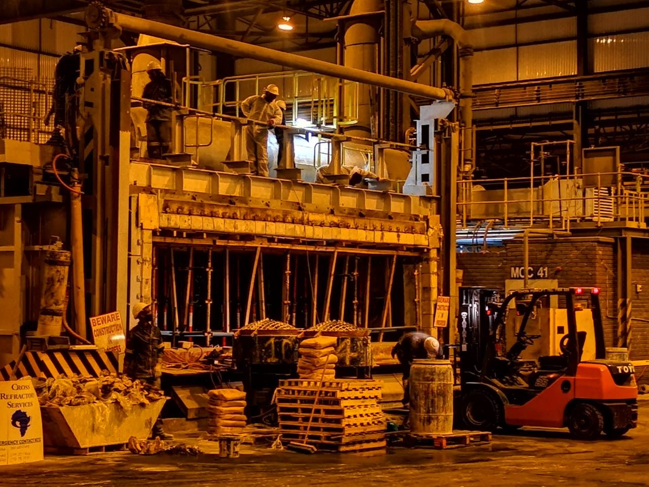 Cross Refractory crew working on a furnace inside a heavy industrial plant