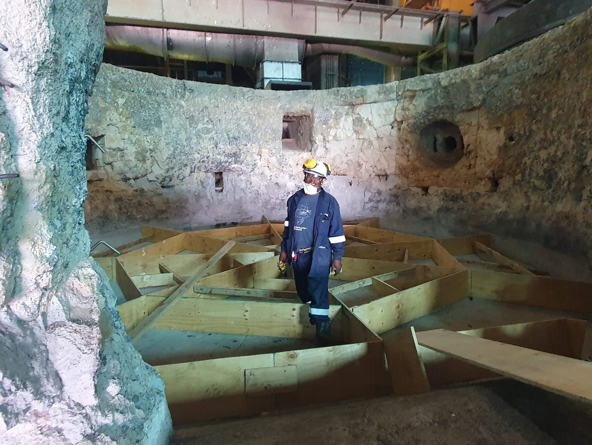 Cross Refractory crew inside an aluminium remelt furnace during a reline